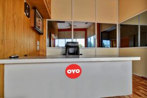 a white counter with aoops sign on it at Hotel O My Choice in Indore
