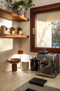 a kitchen counter with a stove and a window at Casa del Viento Private Pool Villa near Kitesurf Beach and Sorobon in Kralendijk