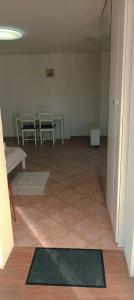 an empty room with a table and chairs in it at Room Monika in Izola