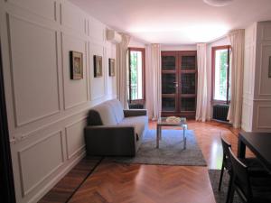 a living room with a couch and a table at Villa G in Ravenna