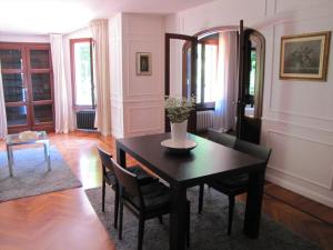 a dining room with a table and chairs at Villa G in Ravenna +66 photos