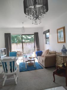 a living room with a couch and a table at Tulip Apartment in Cambridge