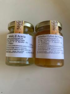 two jars of honey sitting next to each other at Lanizoladelroero in Sommariva Perno
