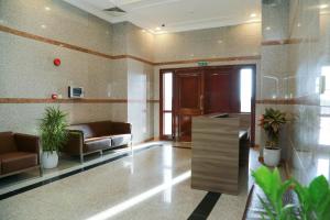 a lobby with couches and chairs in a building at Al Sahwa Residency in Ţāqah