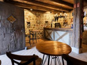 a restaurant with a table and chairs in a room at Maison Kieffer - Hotel & Vins d'Alsace in Itterswiller