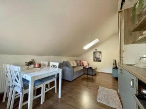a living room with a table and a couch at Stari grad 2 in Valjevo