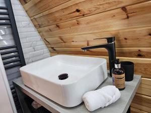 a white sink on a counter in a bathroom at Hill House Doftana in Seciuri +43 photos