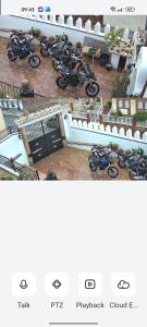 a bunch of motorcycles parked in a parking lot at Casa De Aventuras in Bácor