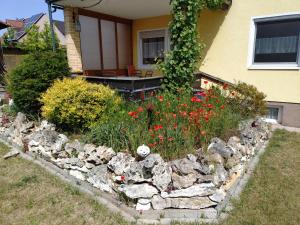 a rock garden in front of a house at FEWO Stephan Grünewald in Gunzenhausen