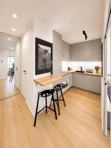 a kitchen with a table and chairs in a room at APARTAMENT 4 bed 2 room WARSAW in Warsaw +4 photos