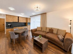 a living room with a couch and a table at TRITA SK - Belanka in Spišská Belá