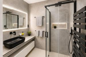 a bathroom with a sink and a shower at TRITA SK - Belanka in Spišská Belá +12 photos