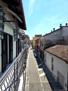 a view of a city street from a balcony at Casa Cordara Apartment in Nizza Monferrato