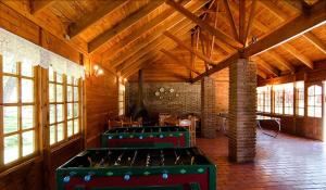 a room with two green trunks in a room with windows at Añañucas III in Las Trancas