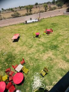 an overhead view of tables and chairs in a field at Rudraksh Hotel & Resturant in Lordi
