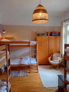 a room with bunk beds and a pendant light at Das Alte Pastorat in Klotten