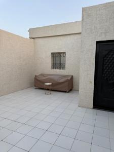 a room with a bed on the side of a building at شاليهات Luma الفندقية in Bisha Airport