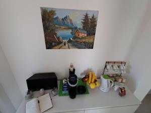 a counter top with various items on a wall at Bouganvillea in Senigallia