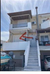 a house with a staircase leading up to a building at Mystegna beach 1 in Skala Mistegnon