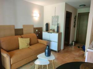 a living room with a couch and a table at Studio N 02 Stalla Sischese in Sisco