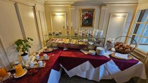 a table with food on it in a room at Hotel Schwanen in Mosbach