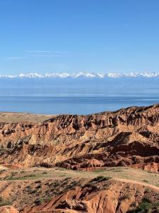 a view of the mountains and water in the desert at Sun Garden Guest House in Ak-Say