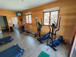 a gym with several exercise bikes in a room at Studio N 02 Stalla Sischese in Sisco