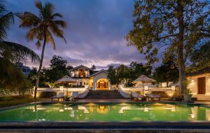 an exterior view of a house with a swimming pool at The Colonial Escape in Galle
