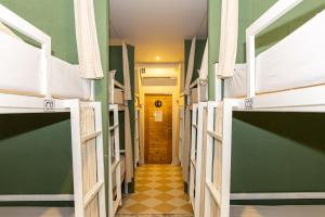 a corridor of a dorm room with bunk beds at Haonorn Hostel in Thong Sala +18 photos