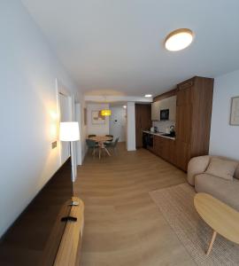 a living room with a couch and a table at Costa Canido II in Malpica