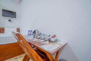 a wooden table with a bunch of machines on it at Into The Wild Sigiriya in Sigiriya