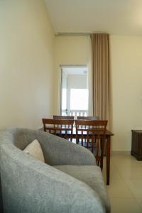a living room with a couch and a table at Al Sahwa Residency in Ţāqah