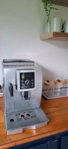 a coffee maker on a counter in a kitchen at Storms River Family Accommodation in Stormsrivier