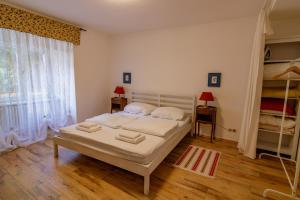 a bedroom with a bed and a large window at B10 Rooms in Baden-Baden