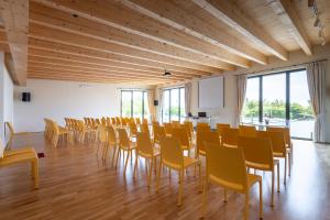 a large room with chairs and tables and windows at Villaggio Dei Fiori in Sanremo +163 photos