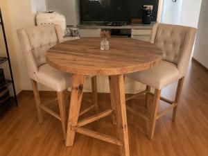 a wooden table and two chairs in a kitchen at Souvenir D Italie in Alatri