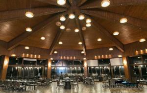 a large room with tables and chairs and a large ceiling at Absheron Marina in Baku