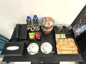 a table with food and drinks on top of it at Love Hotel Hóc Môn in Ho Chi Minh City