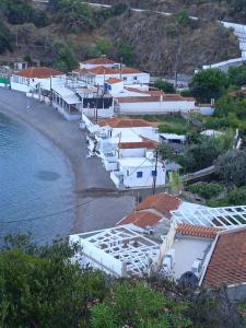 a group of houses on the shore of a beach at Nagos Home in Nagós