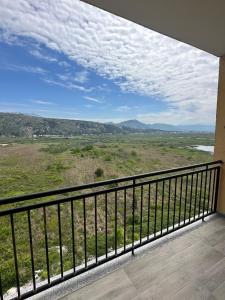 a balcony with a view of a field at Sea flavor 2 in Shëngjin