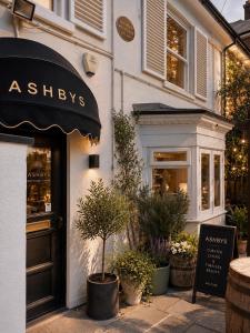 a shop with an awning on the side of a building at Ashbys Accommodation & Spa hire in Portsmouth