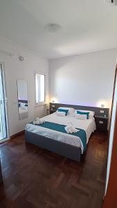 a bedroom with a large bed and a large window at Infinity Blue in Cefalù