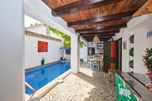 a swimming pool in the middle of a house at Casa Mathilda in Fornes