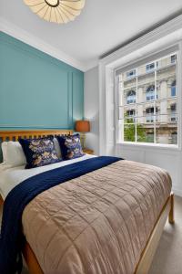 a bedroom with a large bed and a window at Wilton House in Belfast