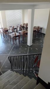 a group of tables and chairs in a room at Piccolo Hotel in Lavagna +20 photos