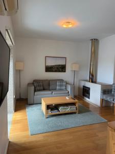 a living room with a couch and a coffee table at Tapada De Sao Domingos in Gondomar