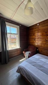 a bedroom with a bed and a window at Ambra Apartaments Palanga in Palanga