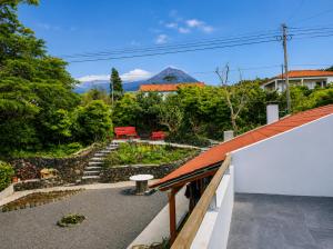 a view of a garden from the roof of a house at Casinha de Pedra in Cais do Pico