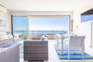 a living room with a view of the ocean at Magnifique appartement avec vue mer panoramique ! in Valras-Plage
