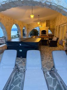 a living room with two chairs and a large tub at Villa Bavaria in Starigrad +126 photos